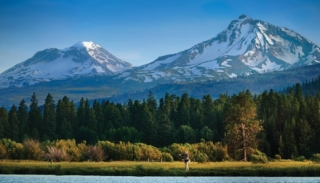 A person fly fishing, one of the best things to do in Sisters, Oregon.