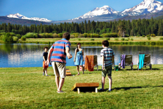 A family playing games at one of the best resorts in Sisters, Oregon.