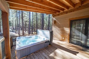 The hot tub at a Sisters can rental to enjoy Oregon views from.